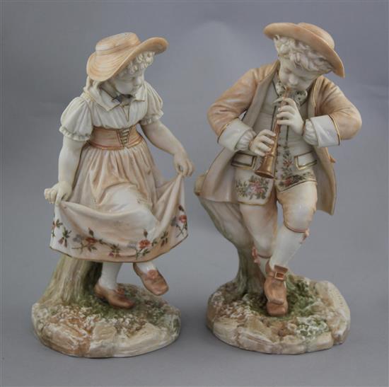 A pair of Royal Worcester blush ivory figures of Kate Greenway style children, modelled by James Hadley, 25.5cm and 24.5cm